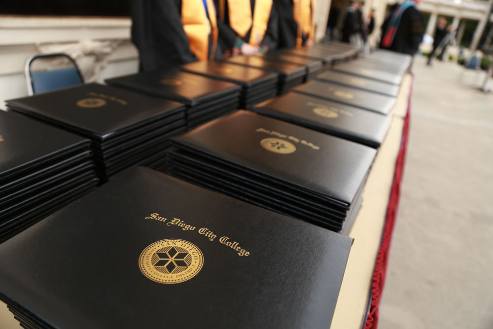 City College diplomas lined up at graduation