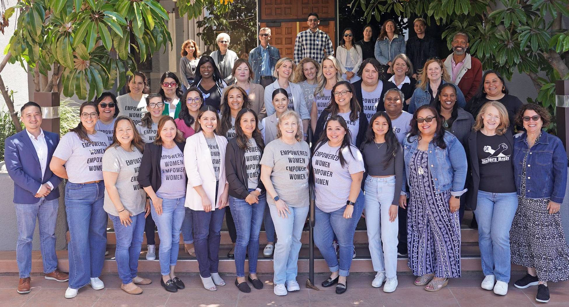 Members of the human resources department wear jeans on denim day in support of abused women