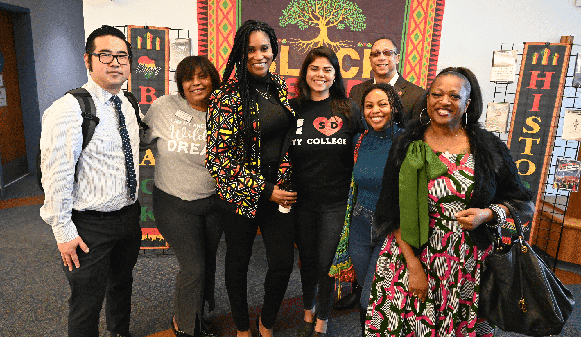 Six employees at a luncheon at City College