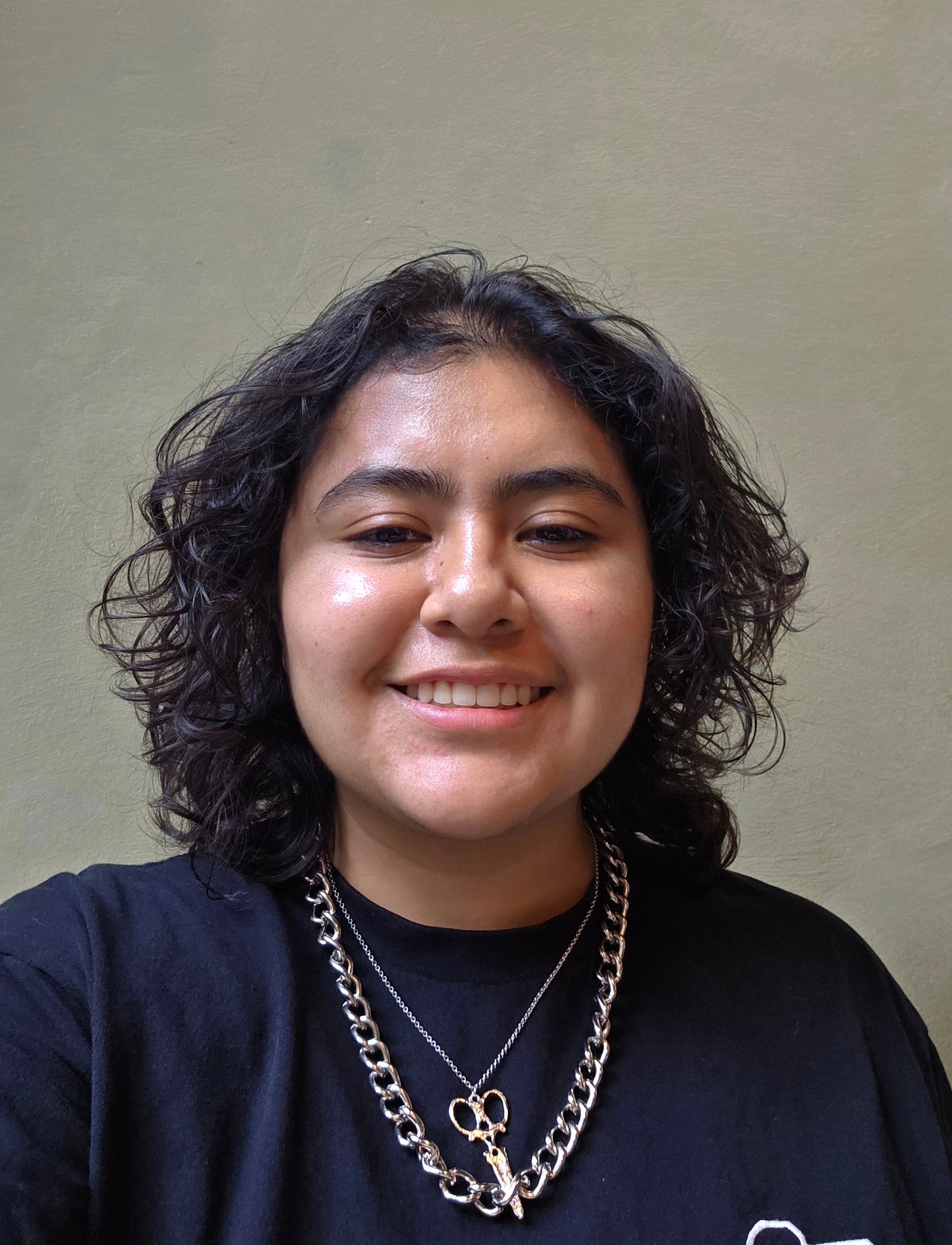  alexia lopez photograph smiling and dark shaggy hair 