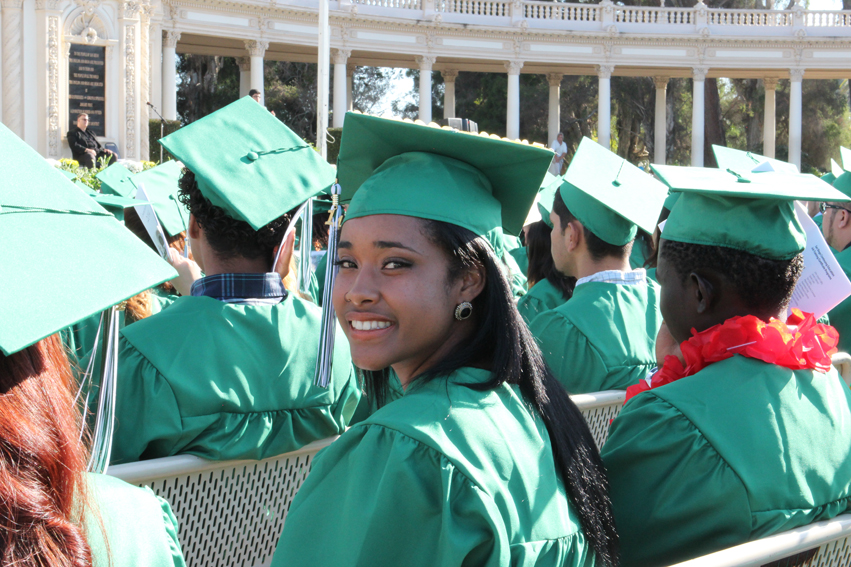 A continuing education graduate in her cap and gown