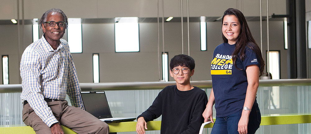 A counselor with two students at the Mesa College transfer center