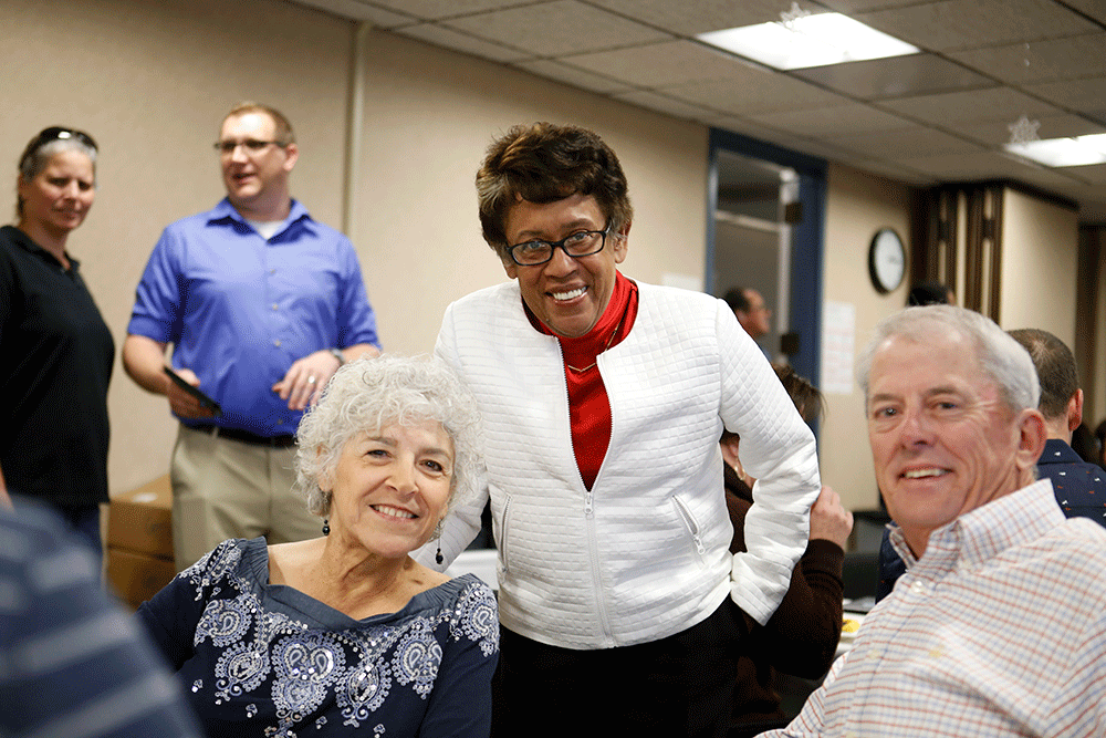 Chancellor Constance M. Carroll with 2 trustees at the 2017 holiday party