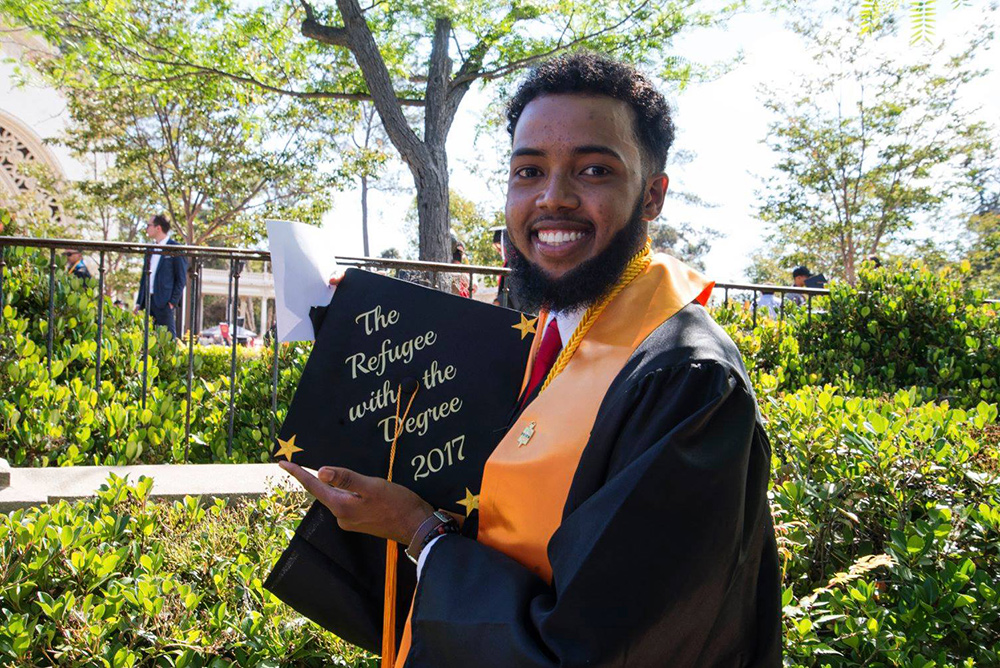 City College graduation shows off his graduation cap