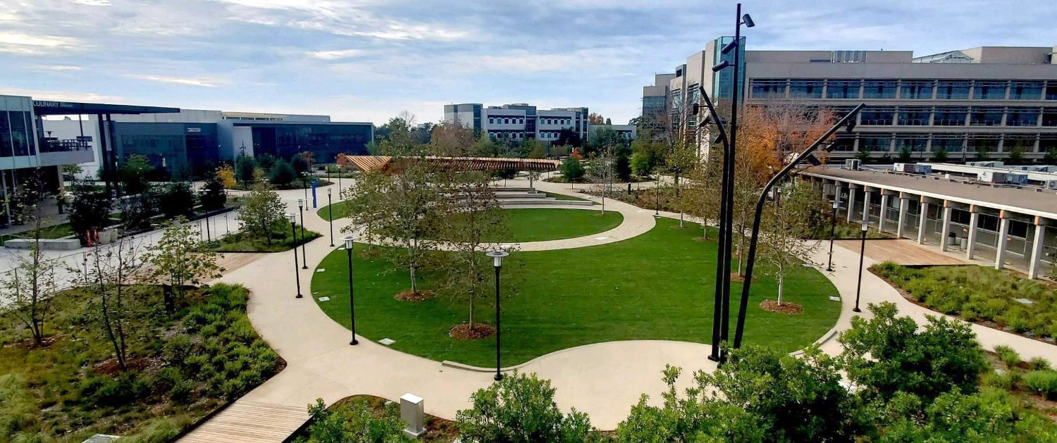 The Mesa Quad features grass, pathways and an outdoor stage