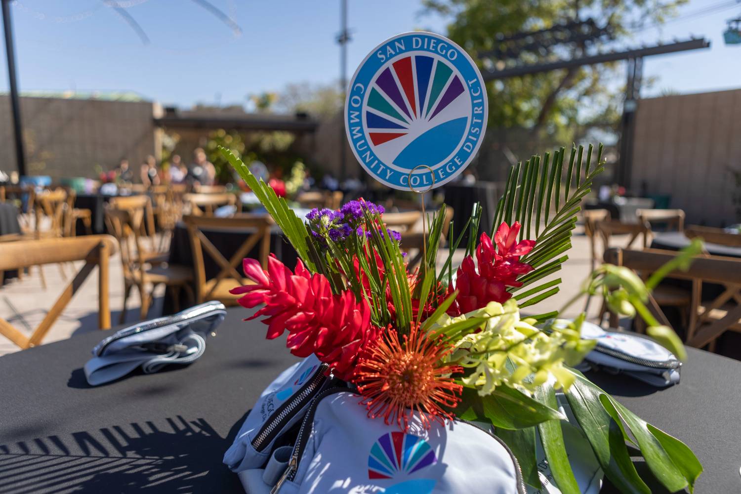District logo in a floral table centerpiece