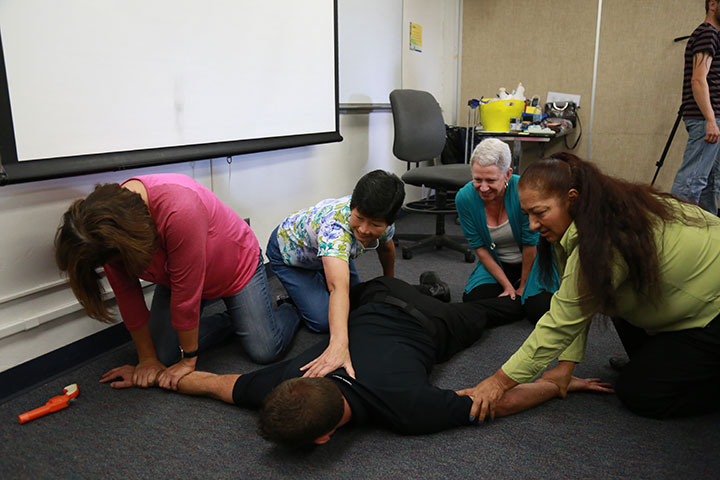 Faculty and staff at San Diego City College participate in training on how to respond to an active-shooter situation. 