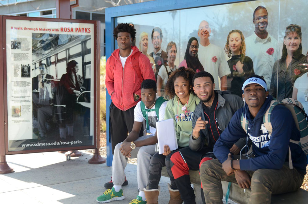 Students sit at the bus stop on Mesa Campus honoring Rosa Parks