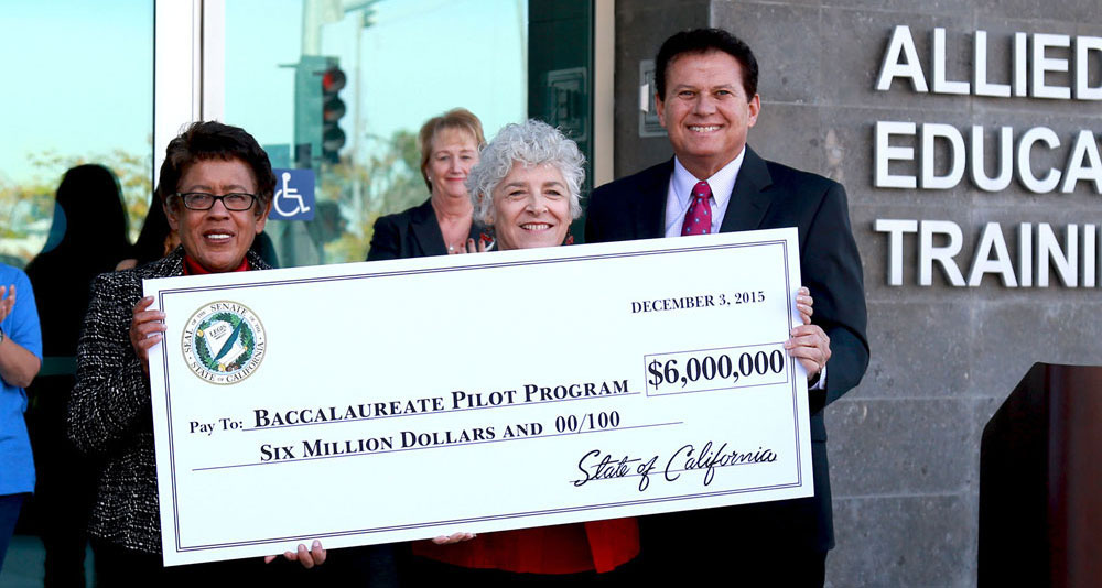 From left, San Diego Community College Chancellor Constance M. Carroll, SDCCD Board of Trustees President Maria Nieto Senor and State Sen. Marty Block hold up a check representing the $6 million that has been secured for the baccalaureate pilot program.