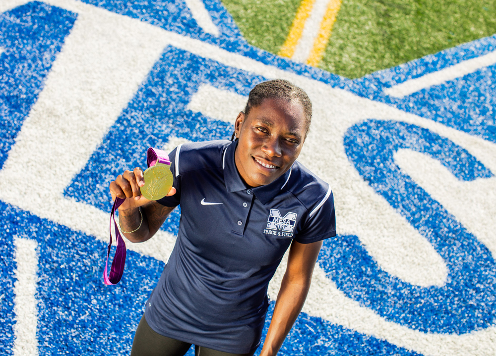 Brittney Reese at the Mesa College track with her London 2012 Olympic Gold medal