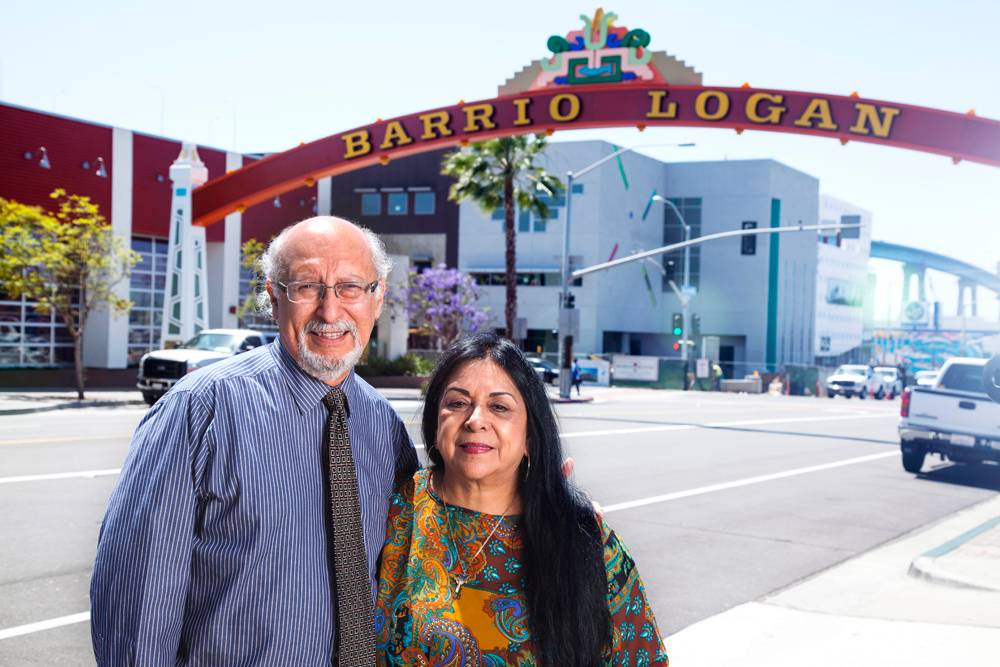 Architect Joseph Martinez and Barrio Station Executive Director Rachael Ortiz at the Barroio Logan gateway with the Cesar E. Chavez Continuing Education campus in the background.