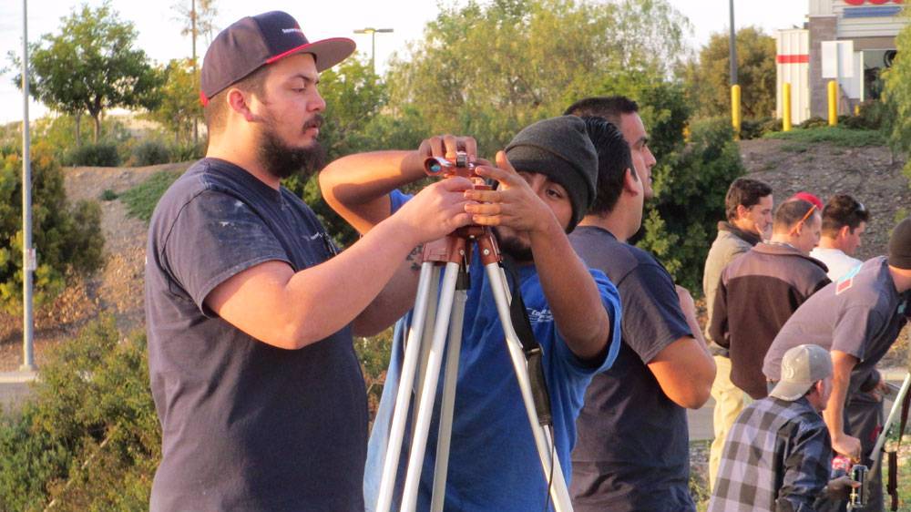 San Diego City College apprenticeship students work on land surveying equipment at the Associated Builders and Contracts training facility in Poway.