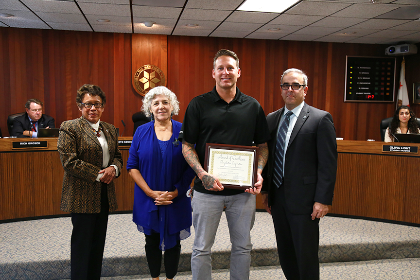 Foreman of Bergelectric, Dan Spotnik, is awarded for his company's work on district construction projects.