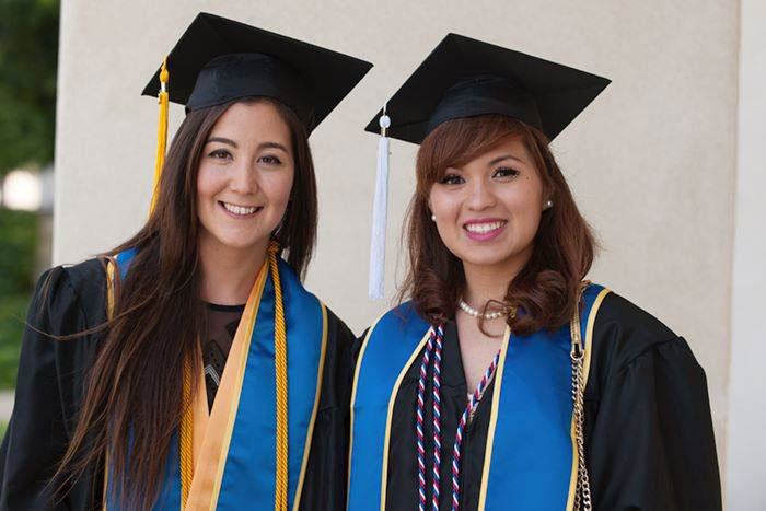 two graduates at San Diego Mesa College graduation in 2017