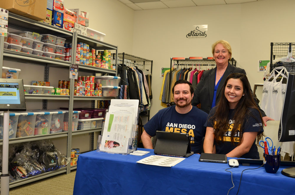 San Diego Mesa College President Pamela Luster with two students at the grand opening of The Stand.