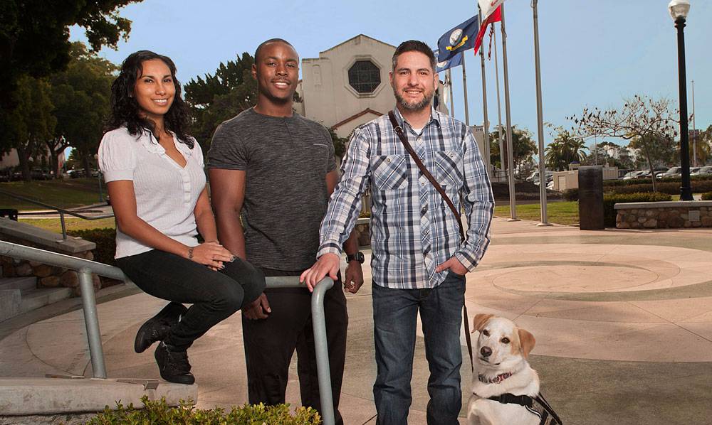 Karina Miranda, Francis Rowe and Randall Dexter with his service dog, Captain.