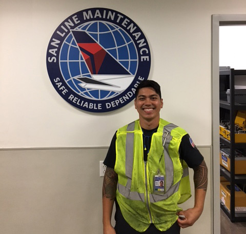 A Miramar College aircraft maintenance student