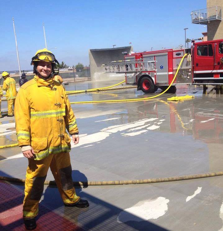 Keegan King in yellow fire gear at Miramar College