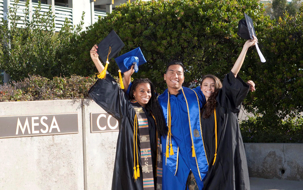 Three Mesa Graduates in caps and gowns celebrate