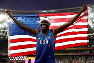 Brittney Reese holds an American flag