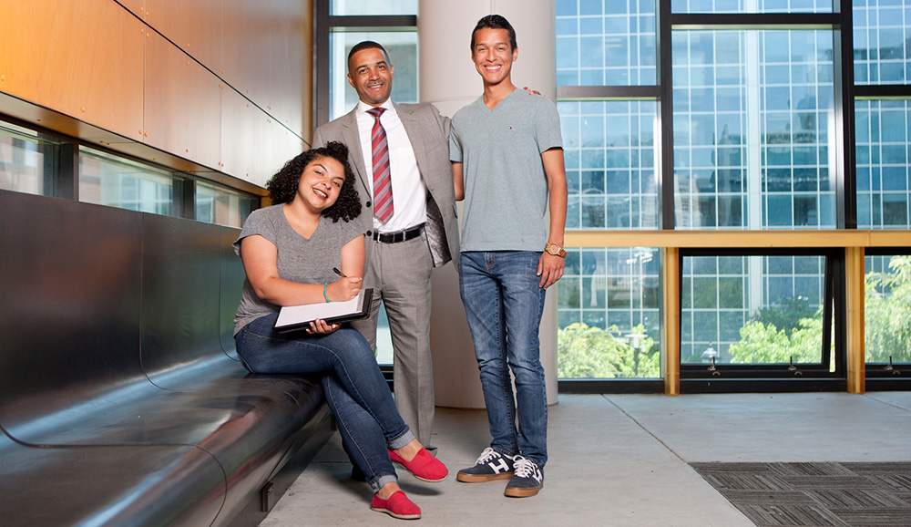 Dr. Ricky Shabazz with two City College students