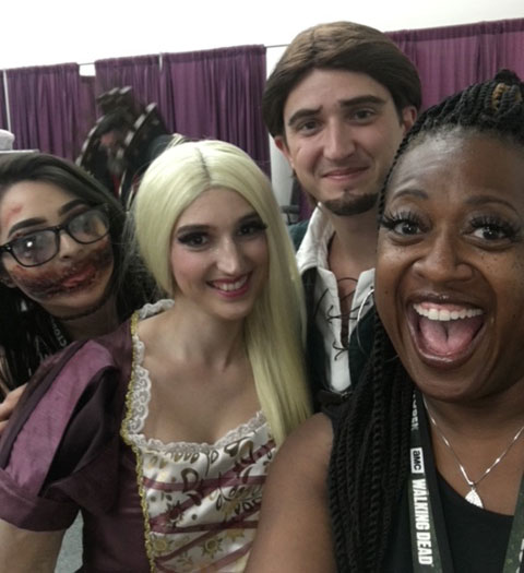 Patricia Grooms-Jones with 3 people in costumes