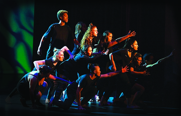 mesa dance members pose onstage