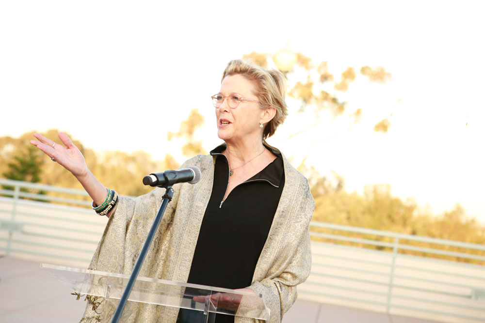 Actress Annette Bening at a podium