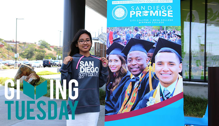 A promise student wears her college sweatshirt