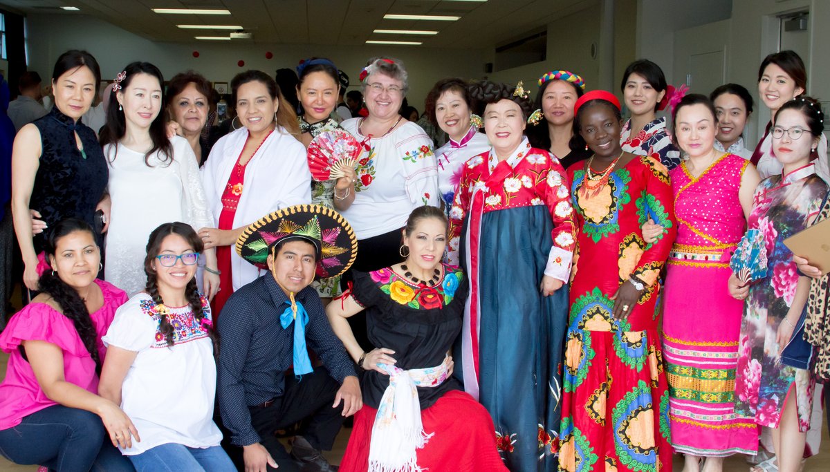 A group of students and staff in multicultural clothing