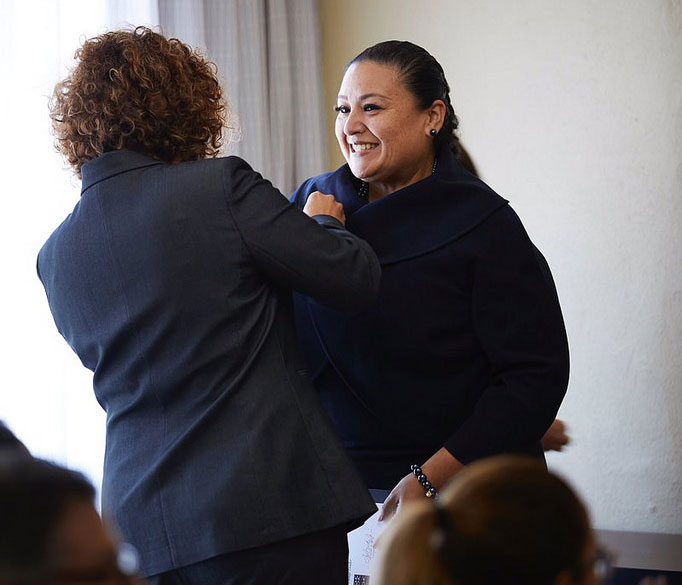 Dr. Star Rivera-Lacey is pinned at a ceremony