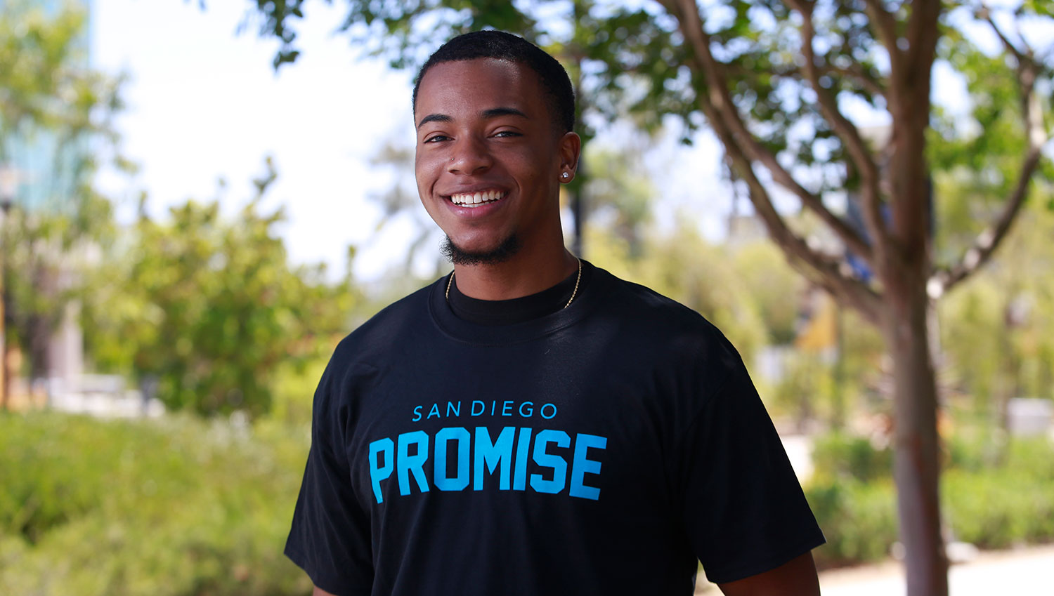 Student Donyal Thompson wearing a Promise T-Shirt