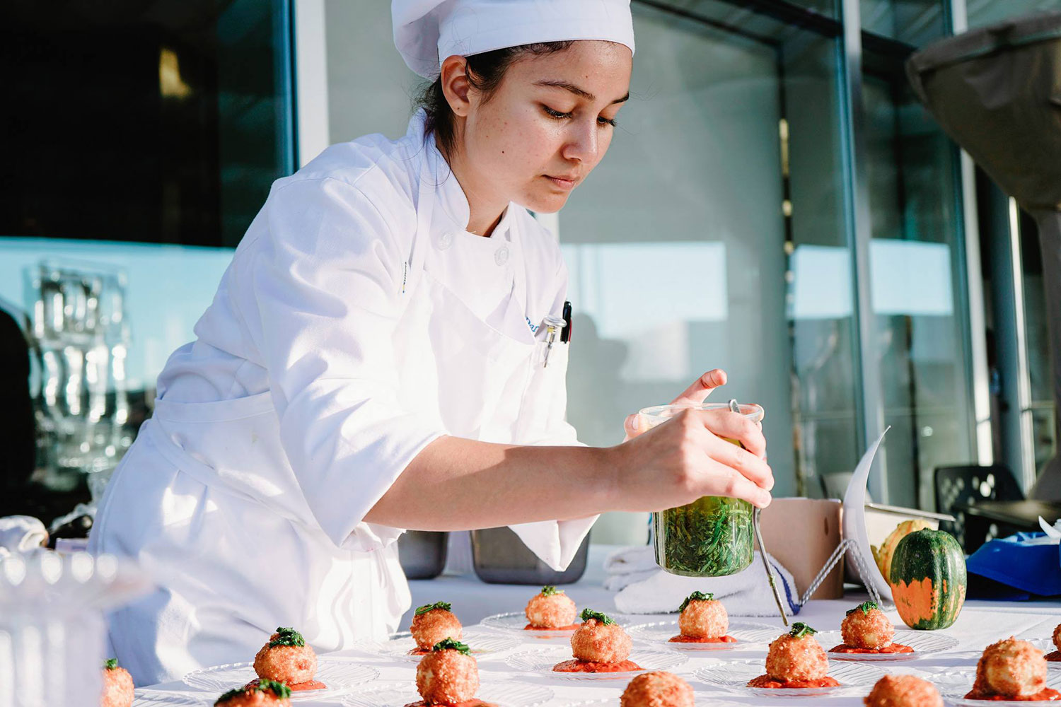 A culinary student prepares hors d'ouevres at the 2018 Taste of Mesa