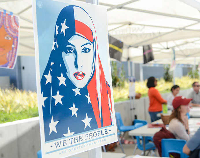 An image of a woman wearing a red white and blue head scarf