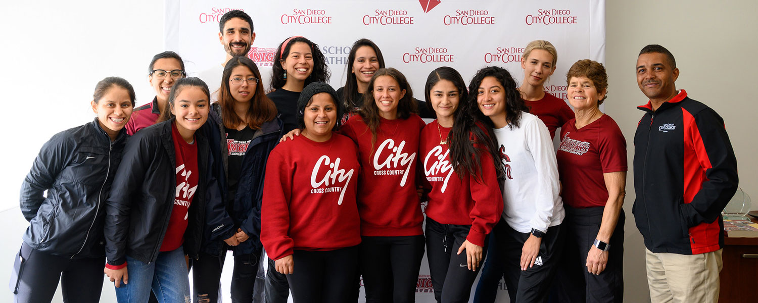 Members and coaches of the City College women’s cross country team pose with President Ricky Shabazz (far right) in celebration of a great season. 