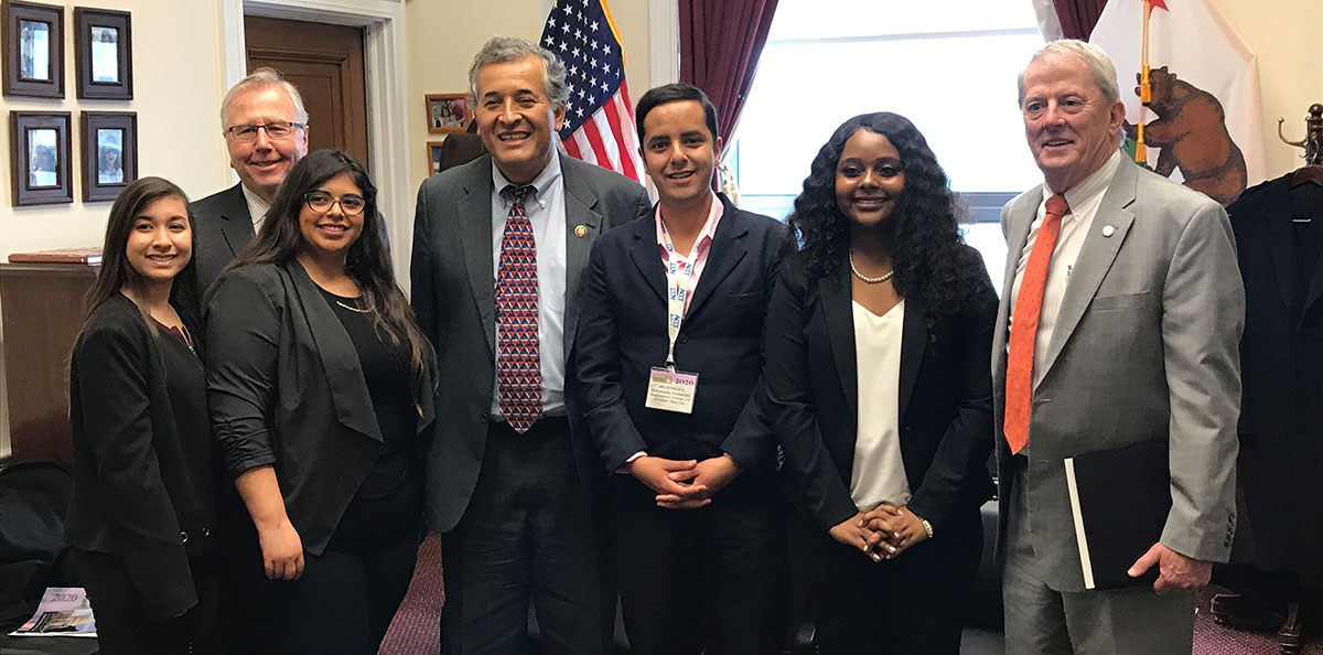 Trustee Bernie Rhinerson (right) with Congressman Juan Vargas (center) and staff.