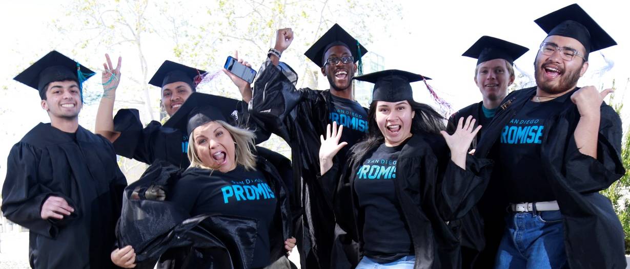 students in promise t-shirts and graduation caps and gowns