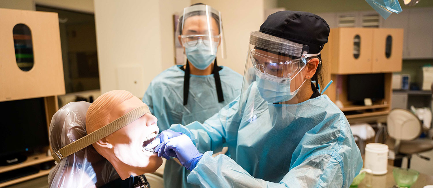 A student conducts lab work in a Dental Assistant Program, one of a handful of district programs that are offering classes on campus. 