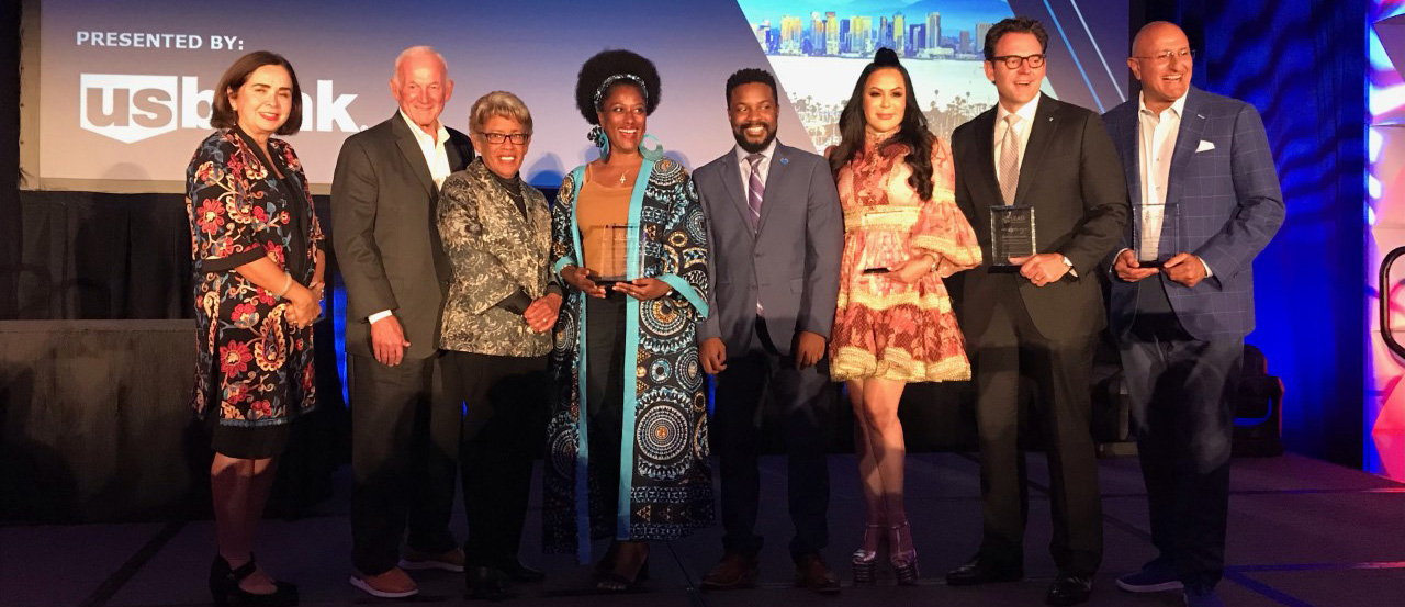 From left, Dr. Adela de la Torre, Jerry Sanders, Dr. Constance Carroll, Tammy T. Blevins and Mathew Gordon of Blue Heart Foundation, Yolanda Selene Walther-Meade, Nathan Fletcher and Sam Attisha on stage with their awards