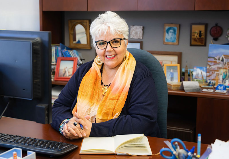 Dr. Isabel OConnor sits at her desk in her office