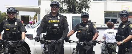 College police in uniform on bicycles at the Pride Parade