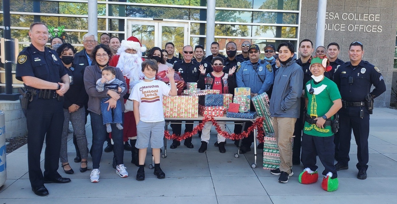 College Police with the sponsored family and gifts