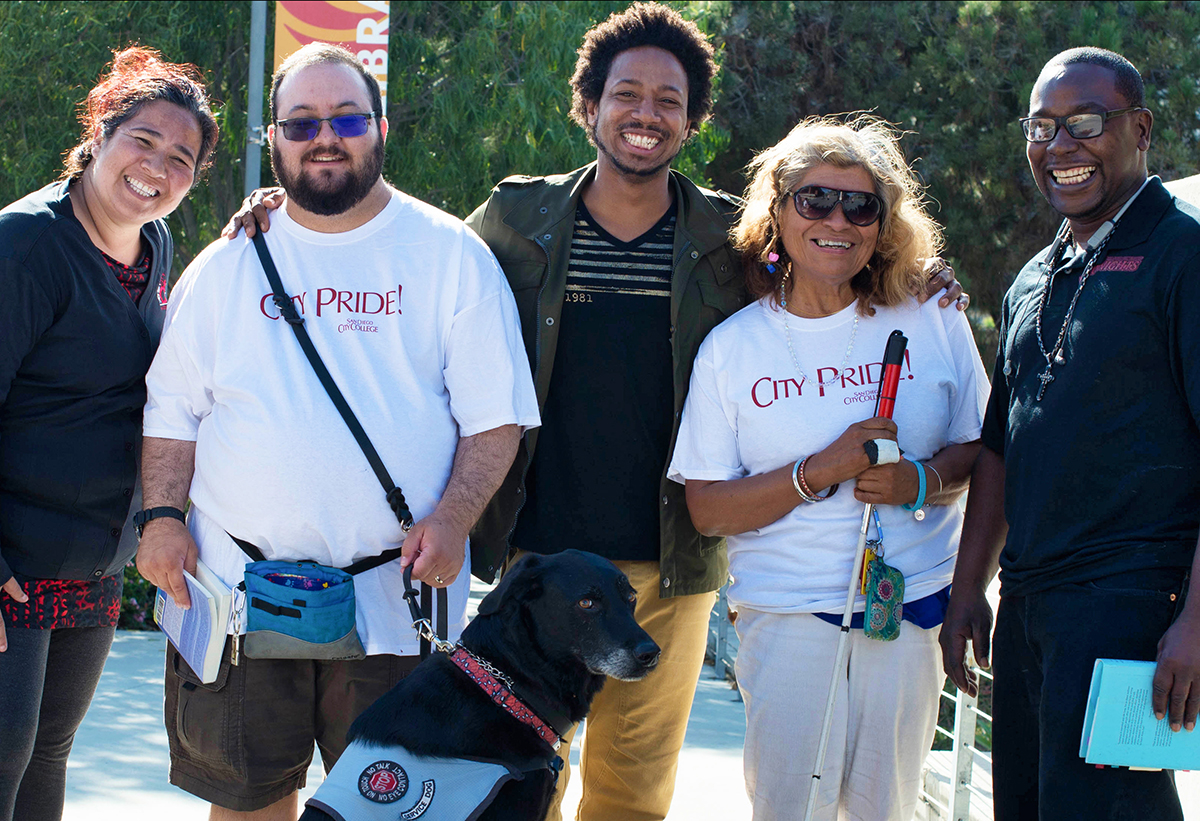 San Diego City College students stroll around campus with members of the campus DSPS team.