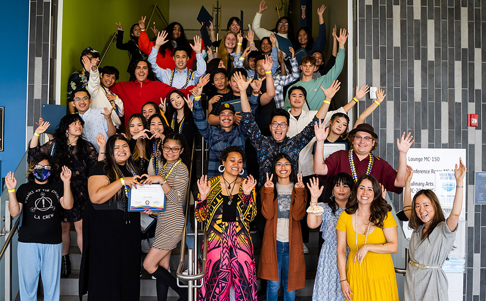 Kapwa Learning Community students join together for a group photo on some stairs