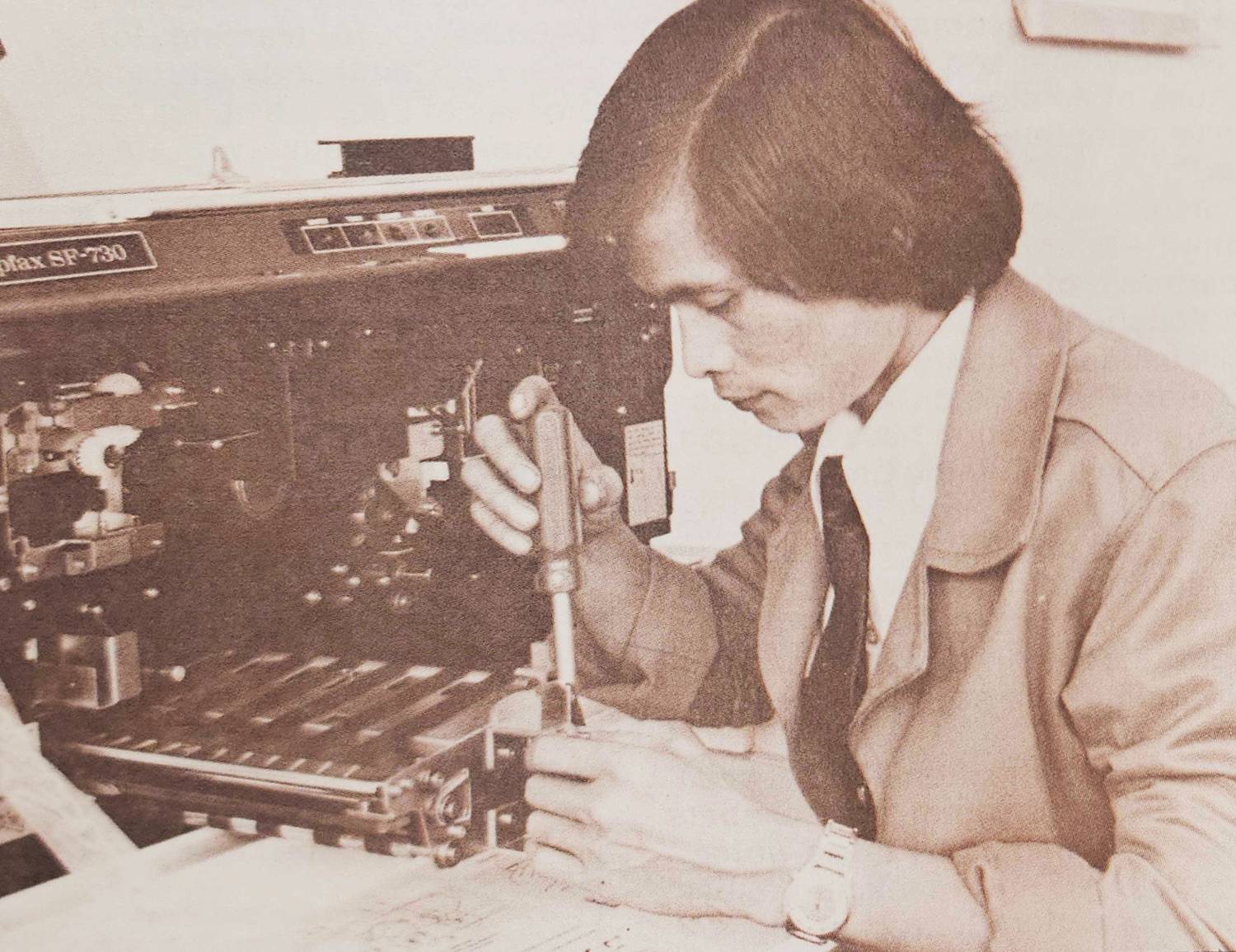 Renato "Ray" Huerto works on a copier in 1978.