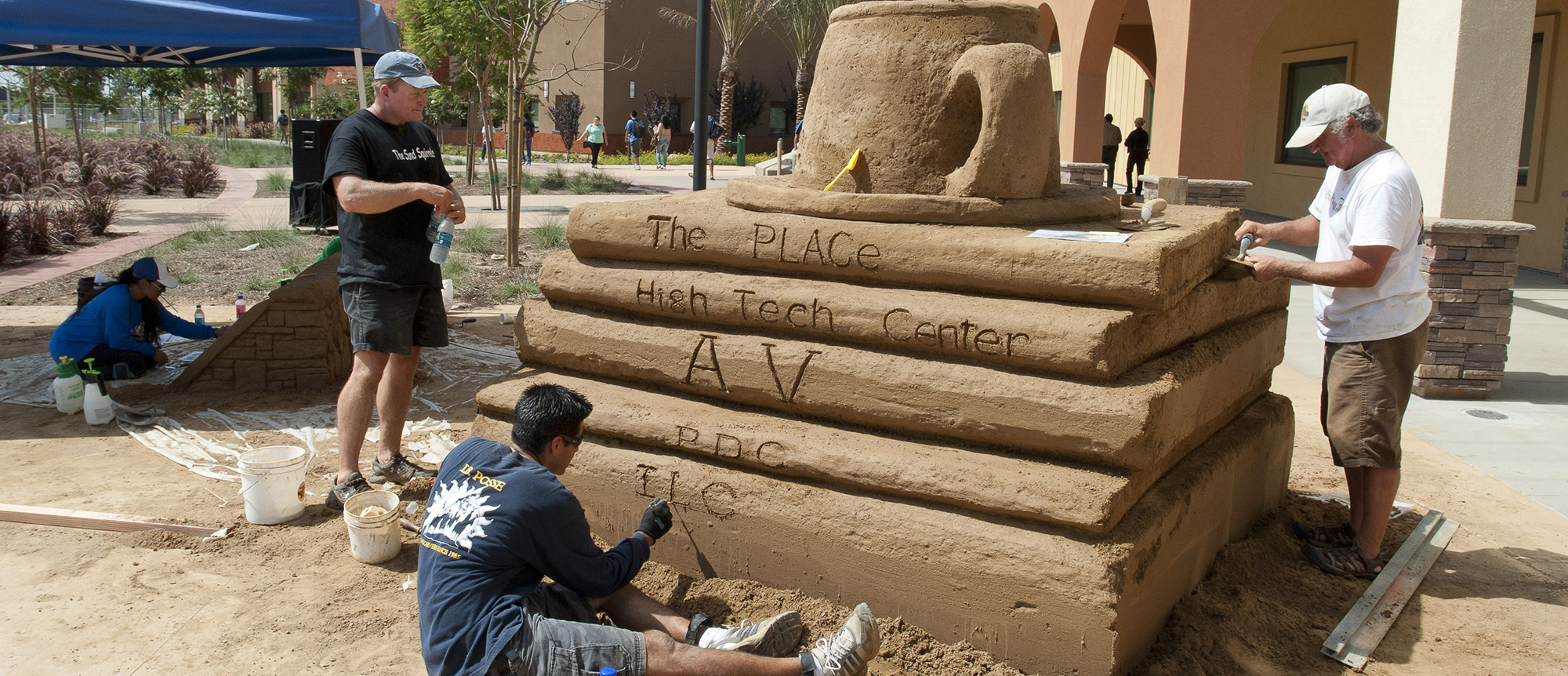 A sand sculpture of a stack of books was constructed for the grand opening of the Miramar Library and Learning Resource Center