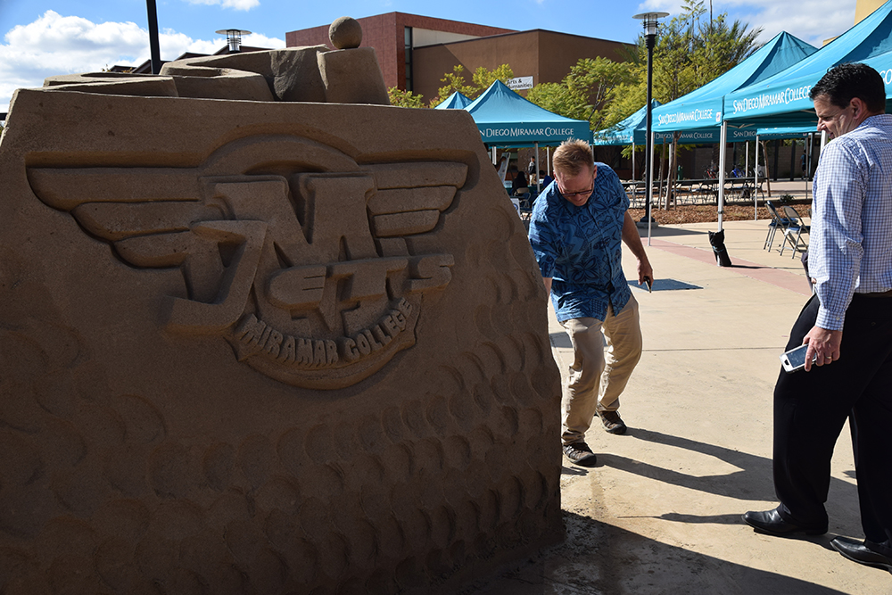 A sand sculpture for Veterans Day shows the Miramar College logo