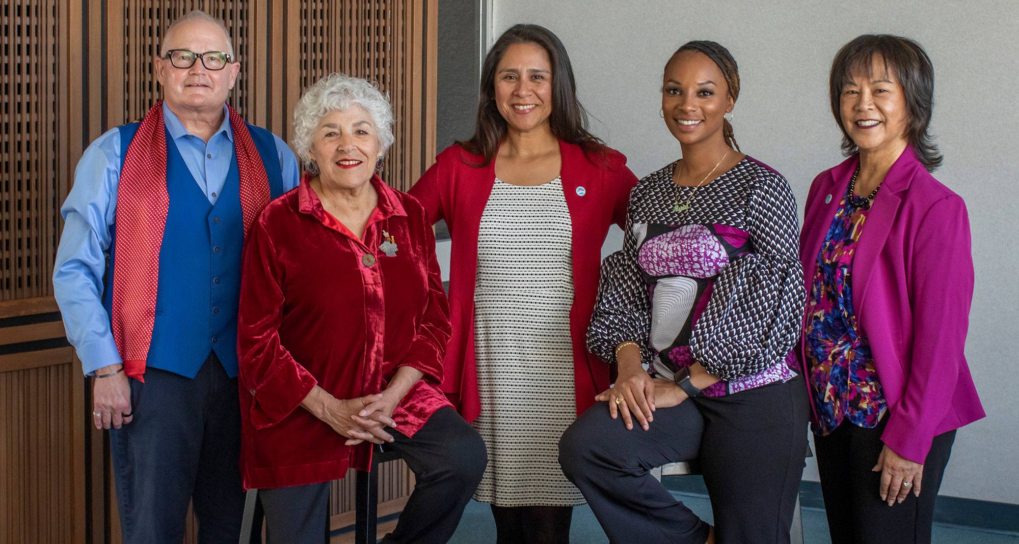 All five trustees in the lobby of the district office. 