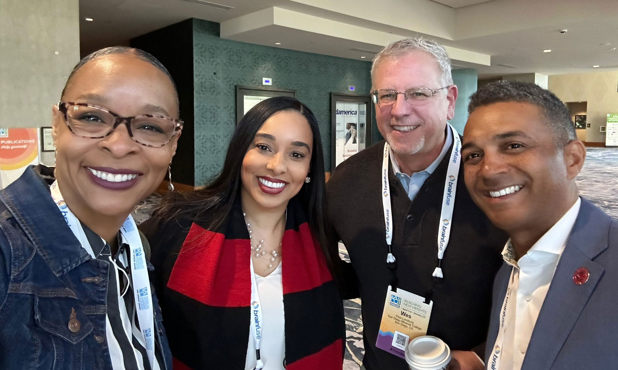 All four college presidents take a group photo