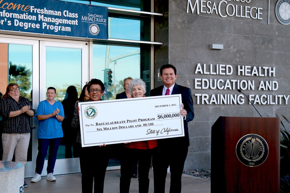 From left, San Diego Community College Chancellor Constance M. Carroll, SDCCD Board of Trustees President Maria Nieto Senor and State Sen. Marty Block hold up a check representing the $6 million that has been secured for the baccalaureate pilot program.